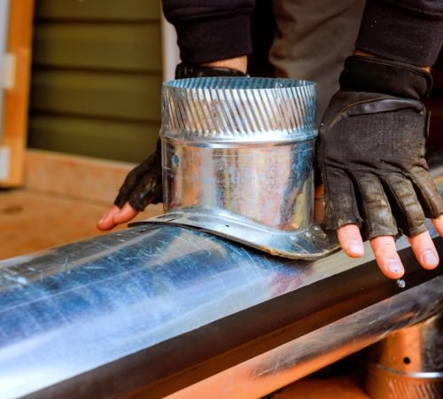 Contractor,Working,With,Metal,Duct,,Securing,Components,For,Hvac,Heating